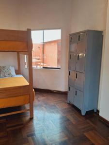 Ένα ή περισσότερα κρεβάτια σε δωμάτιο στο Temazcal Hostel