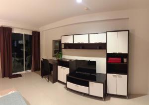 a living room with a large white and black cabinet at Aonang Mountain View in Ao Nang Beach