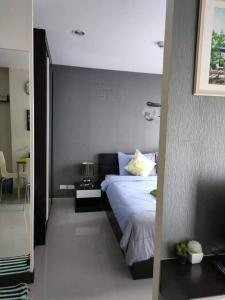 Postel nebo postele na pokoji v ubytování Art on the beach 49