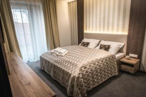 Postel nebo postele na pokoji v ubytování Guest House Frizzante