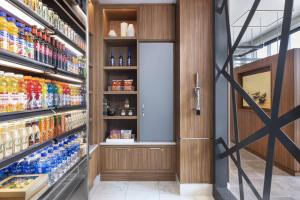 a drink aisle in a grocery store at AC Hotel by Marriott Louisville Downtown in Louisville
