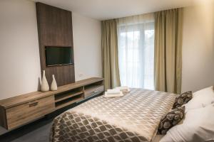 Un pat sau paturi într-o cameră la Guest House Frizzante