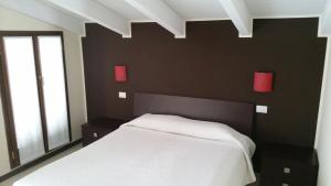 A bed or beds in a room at Residenza S.Event B&B