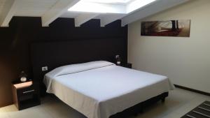 A bed or beds in a room at Residenza S.Event B&B