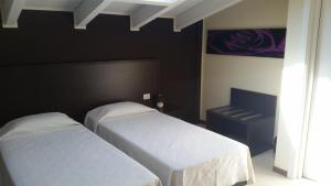 A bed or beds in a room at Residenza S.Event B&B