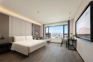 Postel nebo postele na pokoji v ubytování Atour Hotel Zhongshan Henglan Chang New Times Square