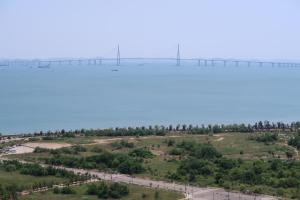 an aerial view of a bridge over a river at Grand Bleu Hotel & Residence in Incheon +37 photos