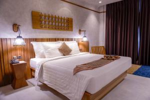 Postel nebo postele na pokoji v ubytování de JAVA Hotel Bandung + 18 fotografií