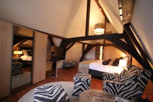 Katil atau katil-katil dalam bilik di Boutique Hotel Steenhof Suites - Adults Only