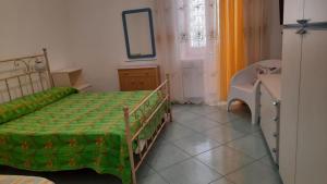 a bedroom with a bed and a dresser and a mirror at Villa Lesto Holiday Home - Ischia Apartment in Ischia