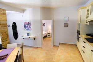 a kitchen with a dining room and a bedroom at Villa Angelo ΙΙ in Paleokastritsa +47 photos
