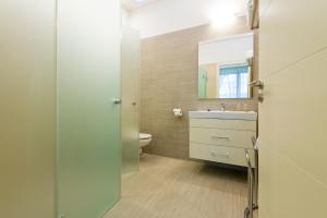 a bathroom with a sink and a toilet at BH Kristály in Debrecen +30 photos