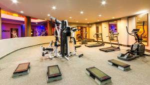 a gym with several treadmills and exercise machines at Costa Mare Suites in Marmaris