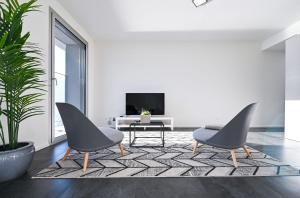 TV a/nebo společenská místnost v ubytování Lake View Suite Melide