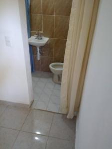 a bathroom with a sink and a toilet at Lodging And Tranquility in Tlaquiltenango