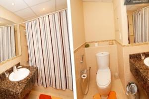 2 immagini di un bagno con servizi igienici e lavandino di 2br Beach front Sea View a Dubai