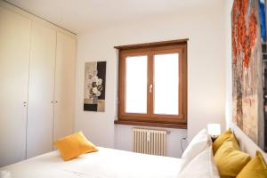 Letto o letti in una camera di Casa Melide Seeblick