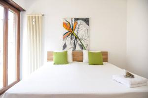 Postel nebo postele na pokoji v ubytování Casa Melide Seeblick