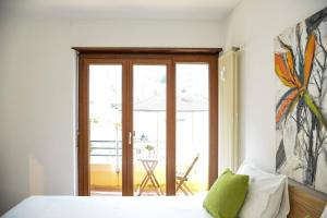 Letto o letti in una camera di Casa Melide Seeblick