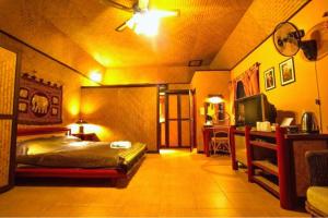 Postel nebo postele na pokoji v ubytování Old Tree's House