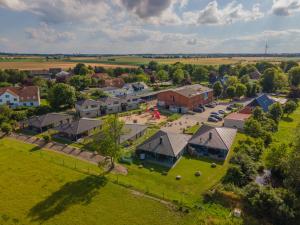 an aerial view of a small town with houses at Bauernhof Lafrenz Wellness - Ferienhaus Ostküste in Fehmarn