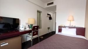 Postel nebo postele na pokoji v ubytování Select Inn Hamamatsu Ekimae