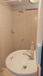 a bathroom with a sink and a toilet at Hb4 Double Room with Private Bathroom and Balcony in Cartagena de Indias