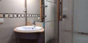 a bathroom with a sink and a shower at Cozy Apartment Near The Beach in Barcelona +13 photos