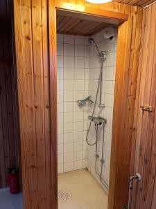 a bathroom with a shower in a room at Charming property with private pool in Märsta