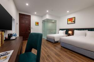 Voodi või voodid majutusasutuse Hanoi Vista Hotel toas