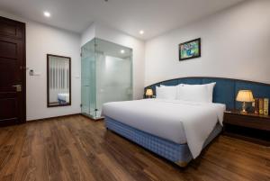 Voodi või voodid majutusasutuse Hanoi Vista Hotel toas