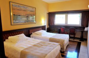Postel nebo postele na pokoji v ubytování Santa Barbara Hotel
