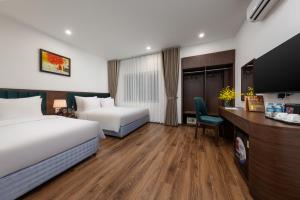 Voodi või voodid majutusasutuse Hanoi Vista Hotel toas