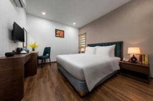Voodi või voodid majutusasutuse Hanoi Vista Hotel toas