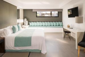 Cama ou camas em um quarto em La Isla y el Mar, Hotel Boutique