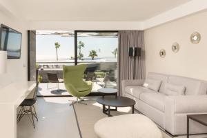 a living room with a couch and a table at La Isla y el Mar, Hotel Boutique in Puerto del Carmen