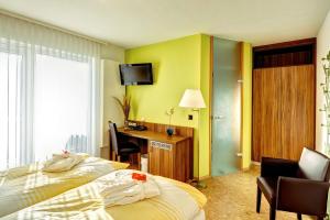 TV a/nebo společenská místnost v ubytování Hotel Muschinsky