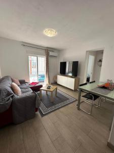 a living room with a couch and a table at Apartment Almazora II Rental Holidays Ref 036 in Almazora