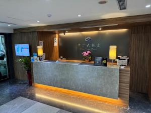 a lobby of a hotel with a reception counter at 雲富大飯店 Hotel Cloud-ZhongShan in Taipei