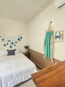 Postel nebo postele na pokoji v ubytování BACALAR INN Hotel