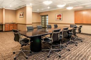 a conference room with a large table and chairs at Comfort Inn & Suites Omaha Central in Omaha +30 photos