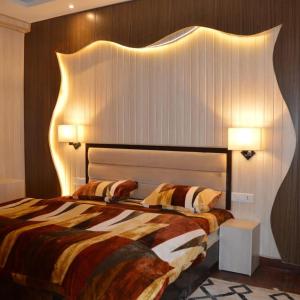 Postelja oz. postelje v sobi nastanitve Royal Residency Inn - Manali