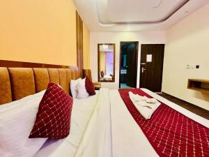 Postelja oz. postelje v sobi nastanitve Royal Residency Inn - Manali