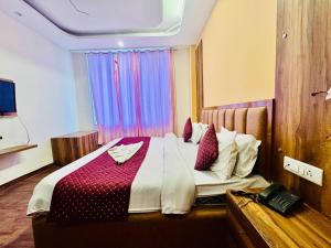 Postelja oz. postelje v sobi nastanitve Royal Residency Inn - Manali