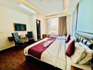Postelja oz. postelje v sobi nastanitve Royal Residency Inn - Manali