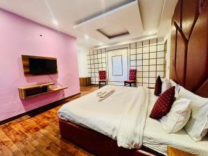 Postelja oz. postelje v sobi nastanitve Royal Residency Inn - Manali