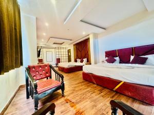 Postelja oz. postelje v sobi nastanitve Royal Residency Inn - Manali
