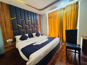 Postelja oz. postelje v sobi nastanitve Royal Residency Inn - Manali