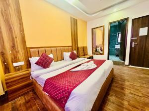 Postelja oz. postelje v sobi nastanitve Royal Residency Inn - Manali