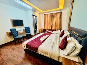 Postelja oz. postelje v sobi nastanitve Royal Residency Inn - Manali